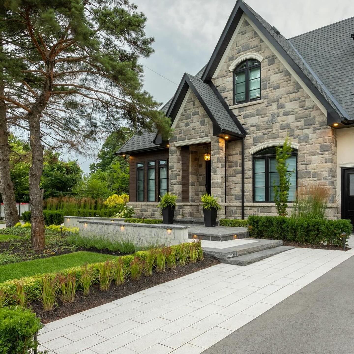 Stone entrance and planted front garden