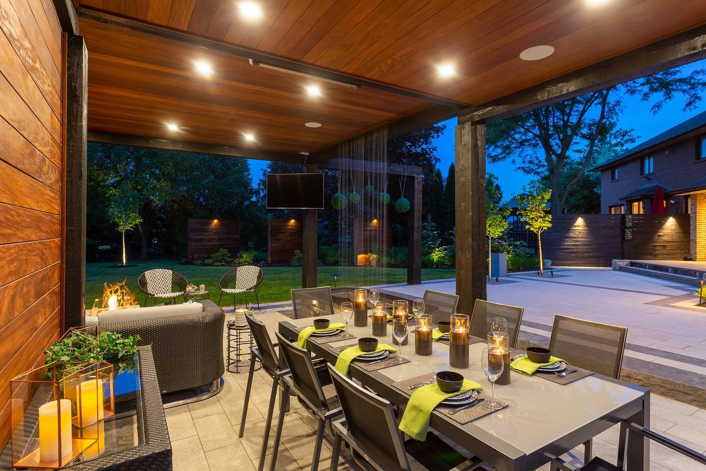 Outdoor dining beneath a timber pavilion
