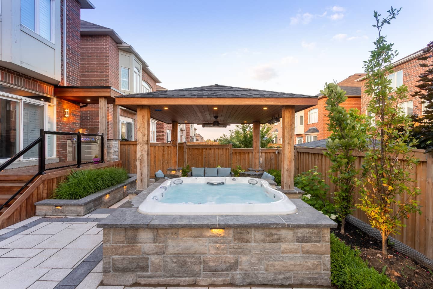 Hot tub, covered lounge and landscaped patio
