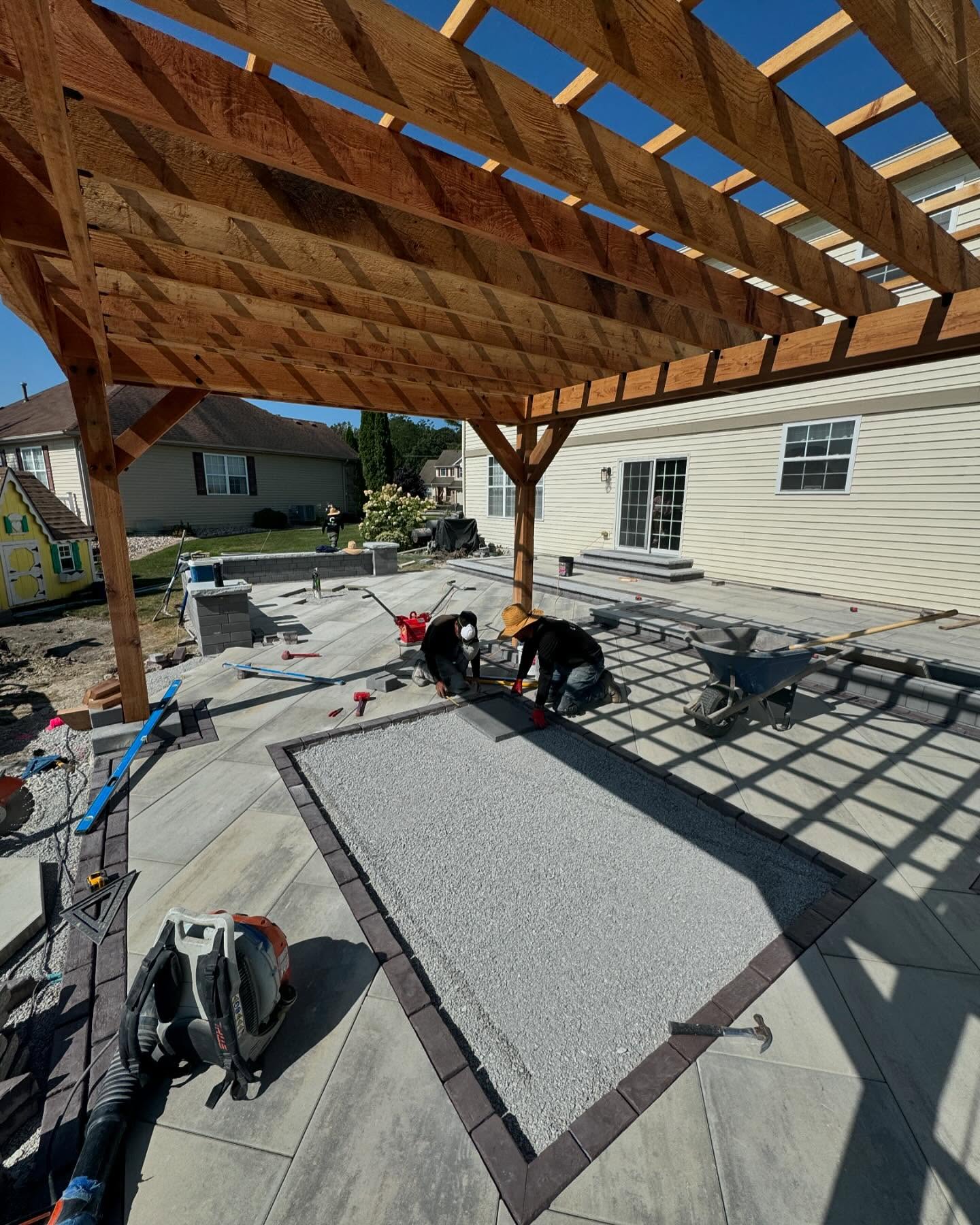 Paving installation under a pergola