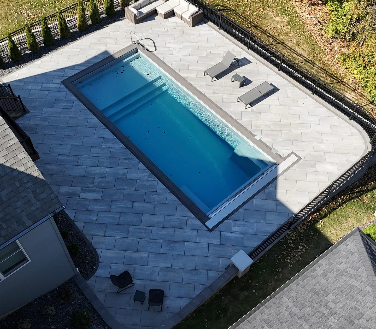 Rectangular pool and curved paving